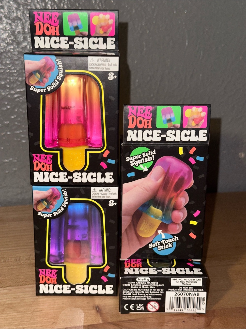 1 NeeDoh Nice-Sicle Squishy Toy — Purple & Yellow